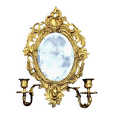 Antique bronze wall sconce with two candlesticks and beveled mirror