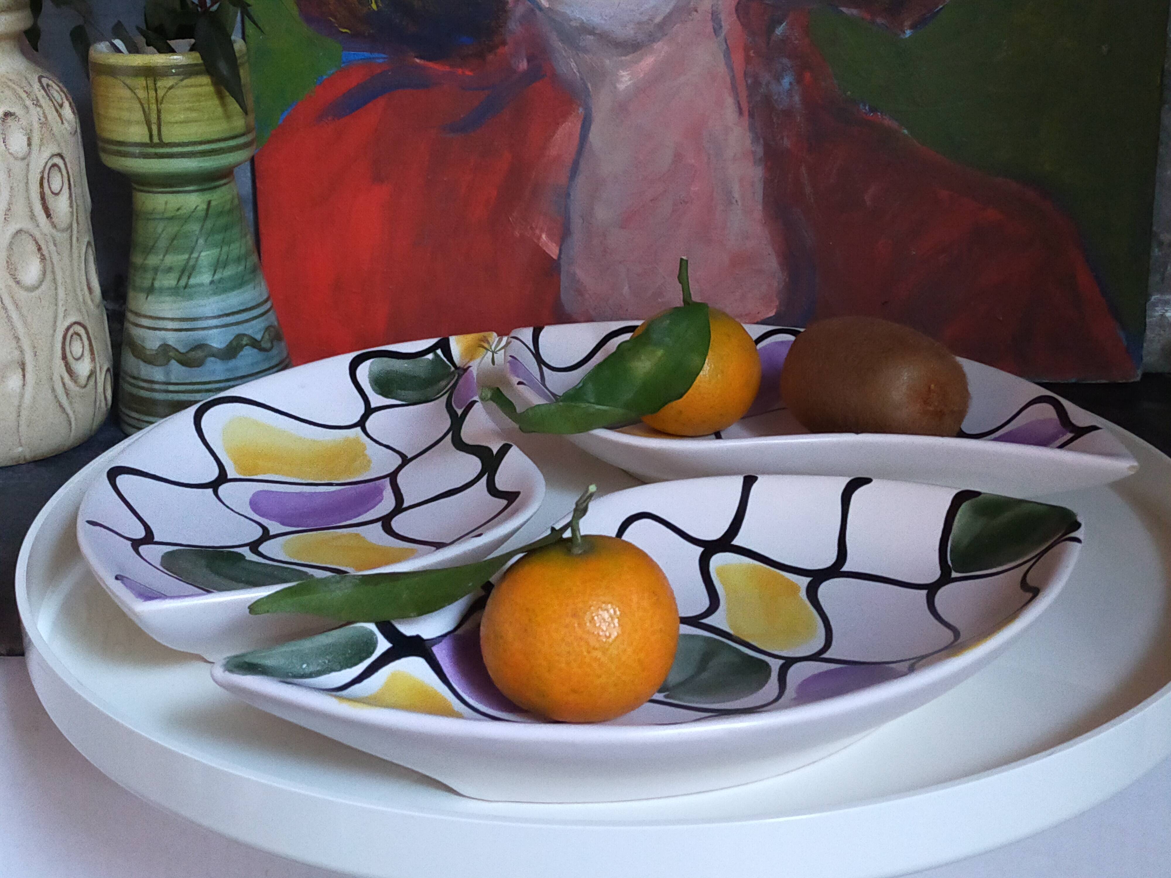 Three vintage free-form ceramic ravine dishes from the 1950s