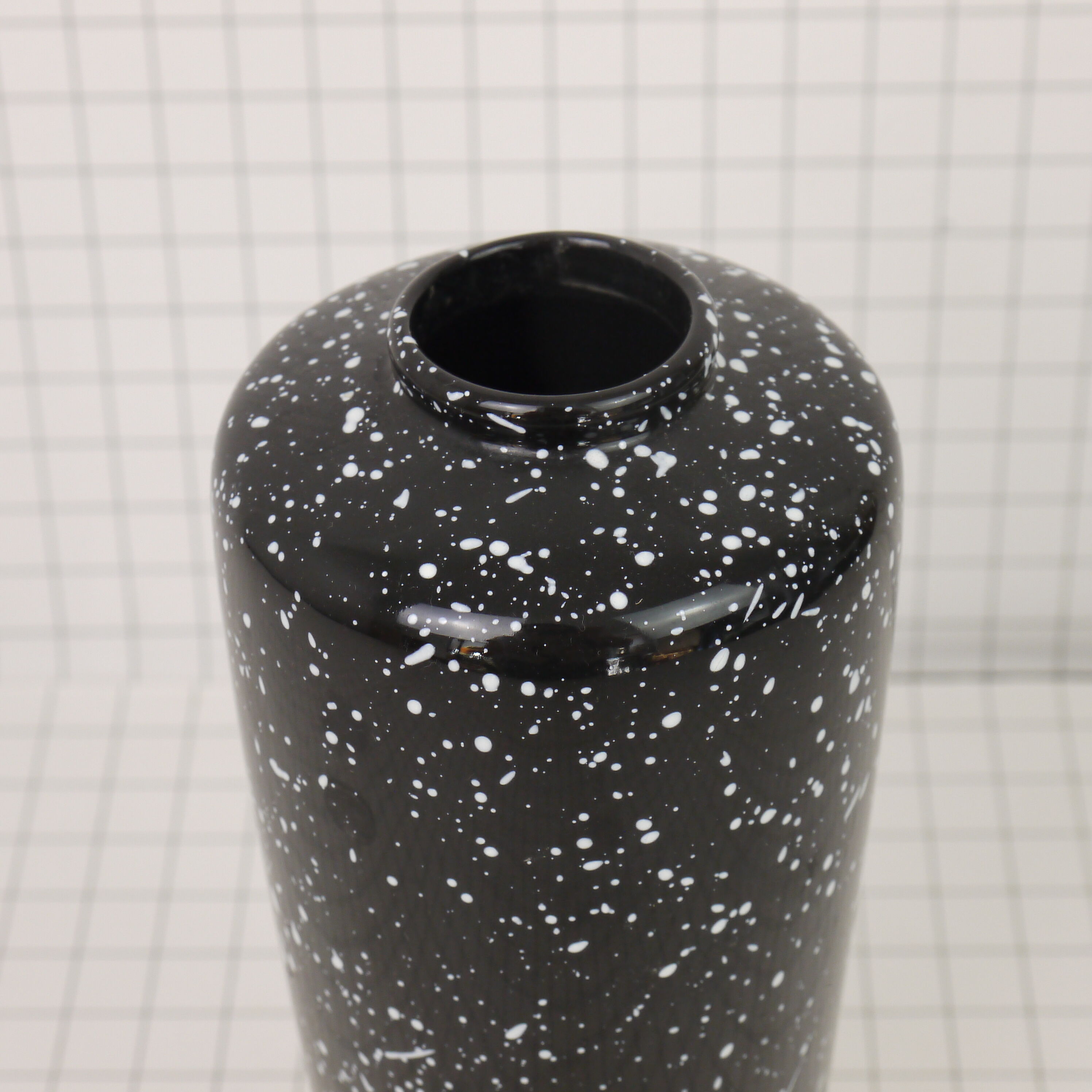Black and white speckled vase