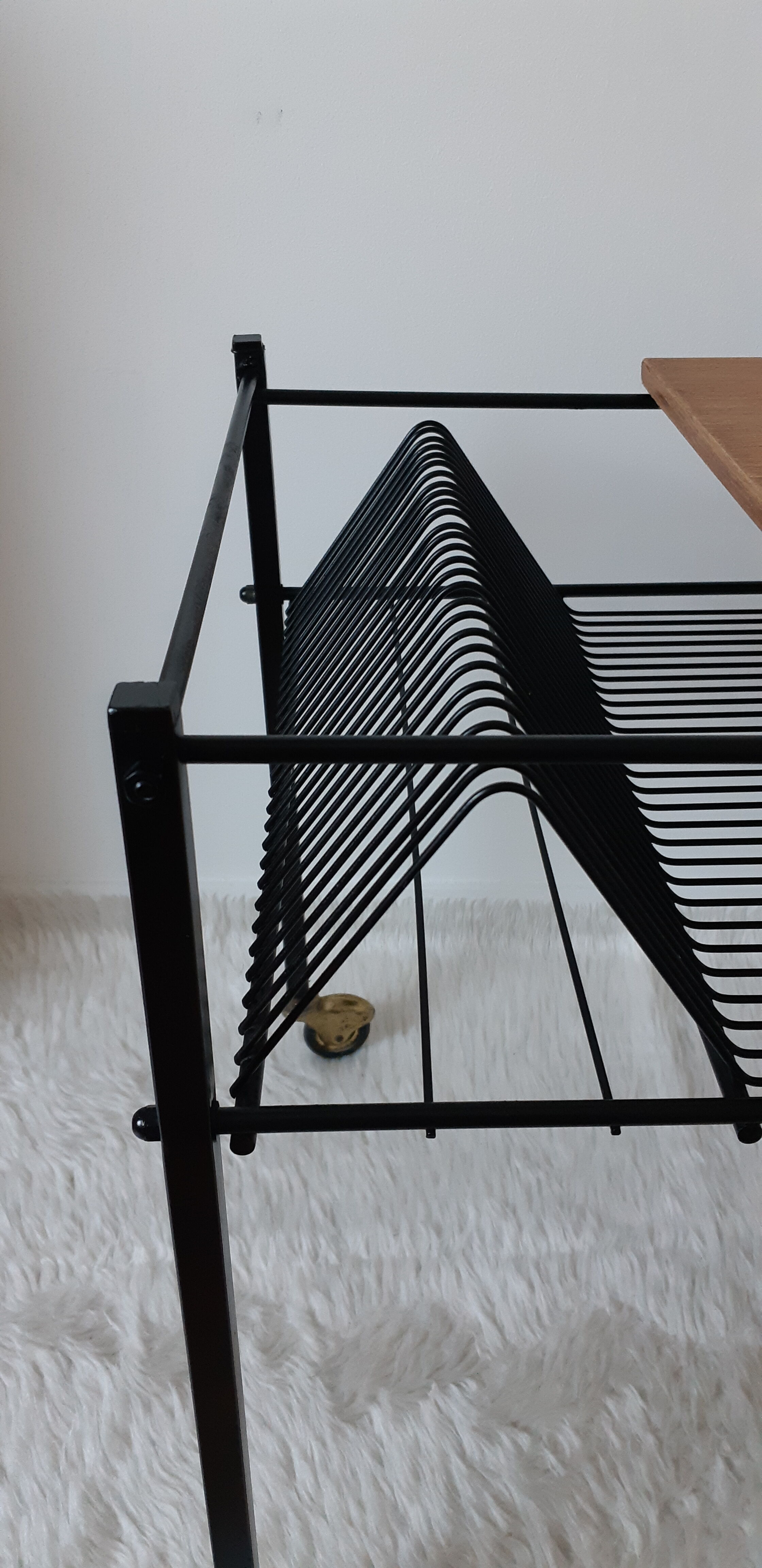 Table has record player, wearing vintage discs