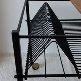 Table has record player, wearing vintage discs