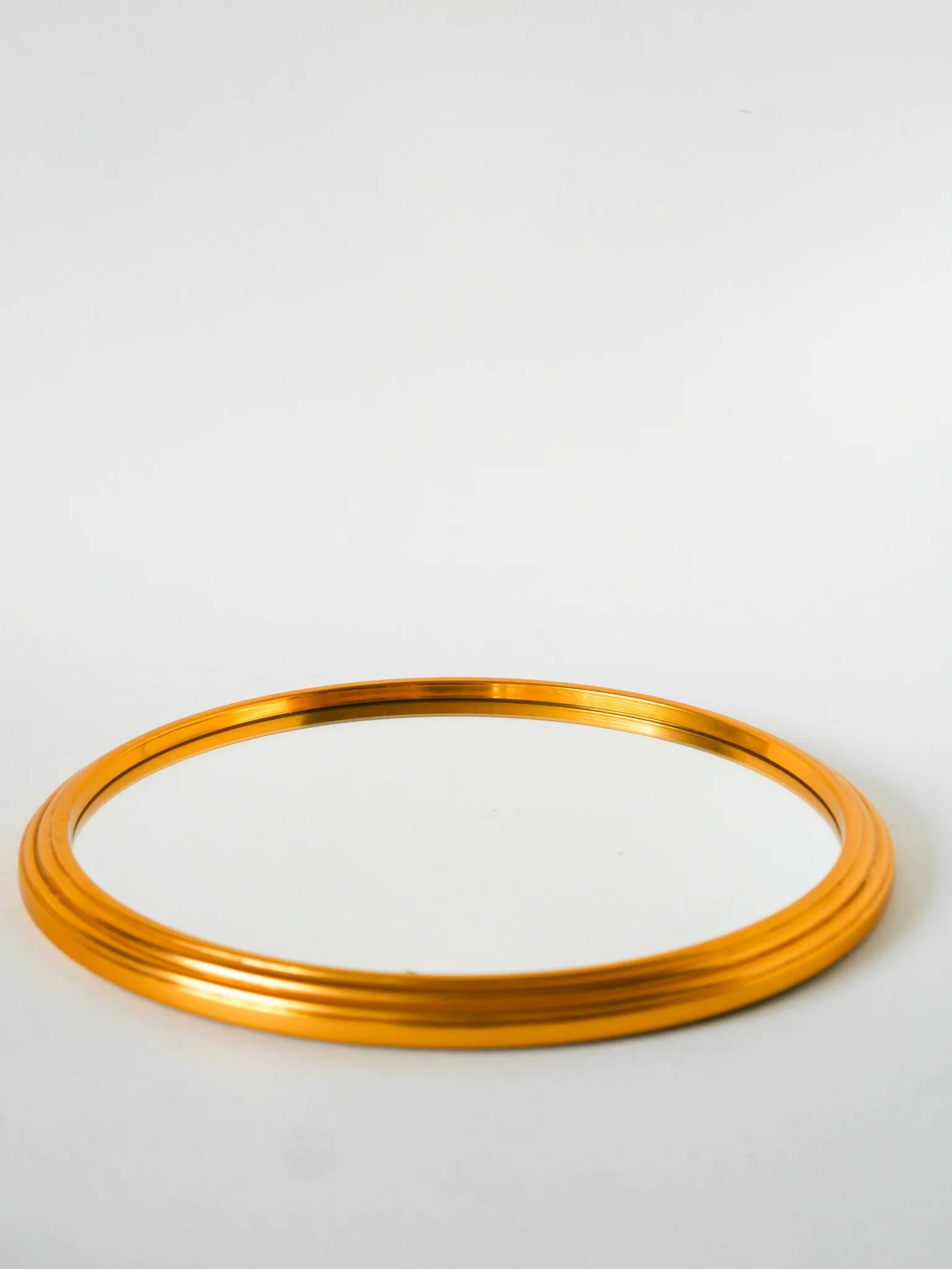 Small round mirror tray, gold, 1960