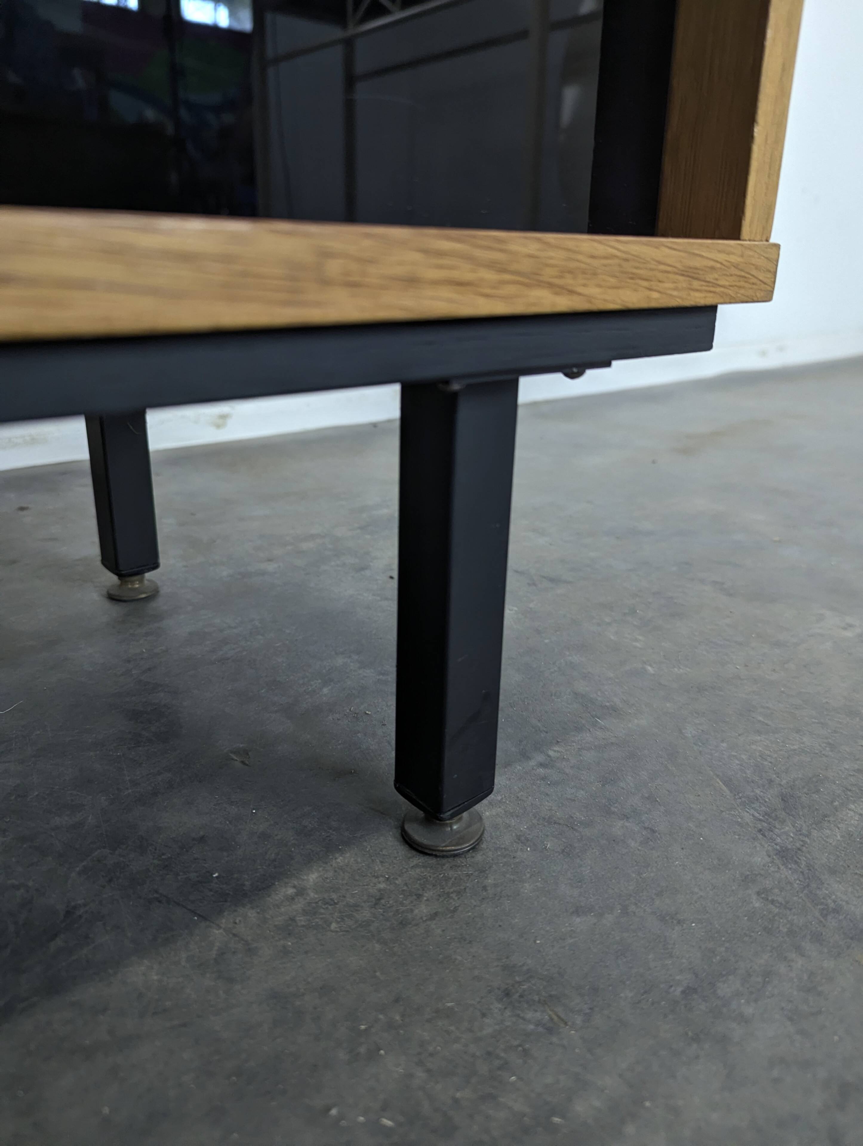 Pair of modernist sideboards with black glass doors in oak veneer.
