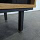 Pair of modernist sideboards with black glass doors in oak veneer.