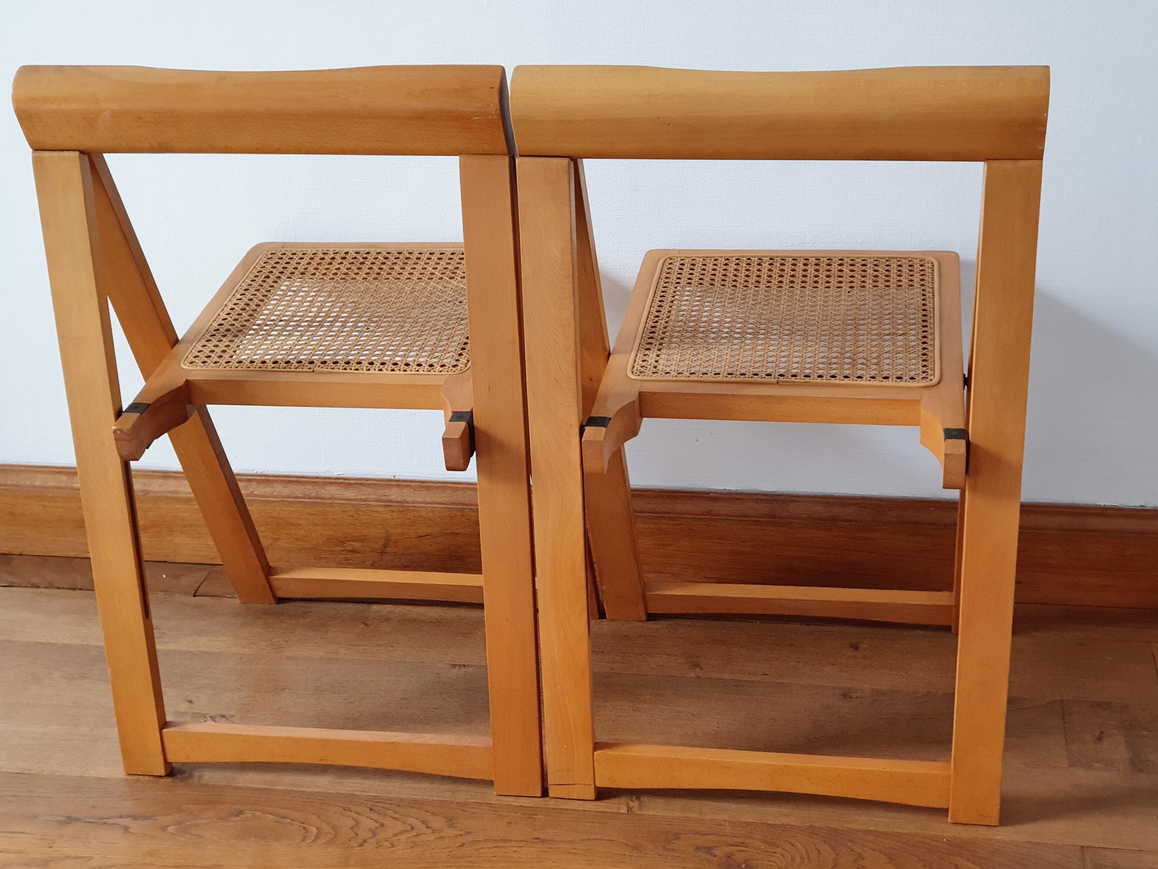 Pair of canned folding chairs.