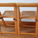 Pair of canned folding chairs.
