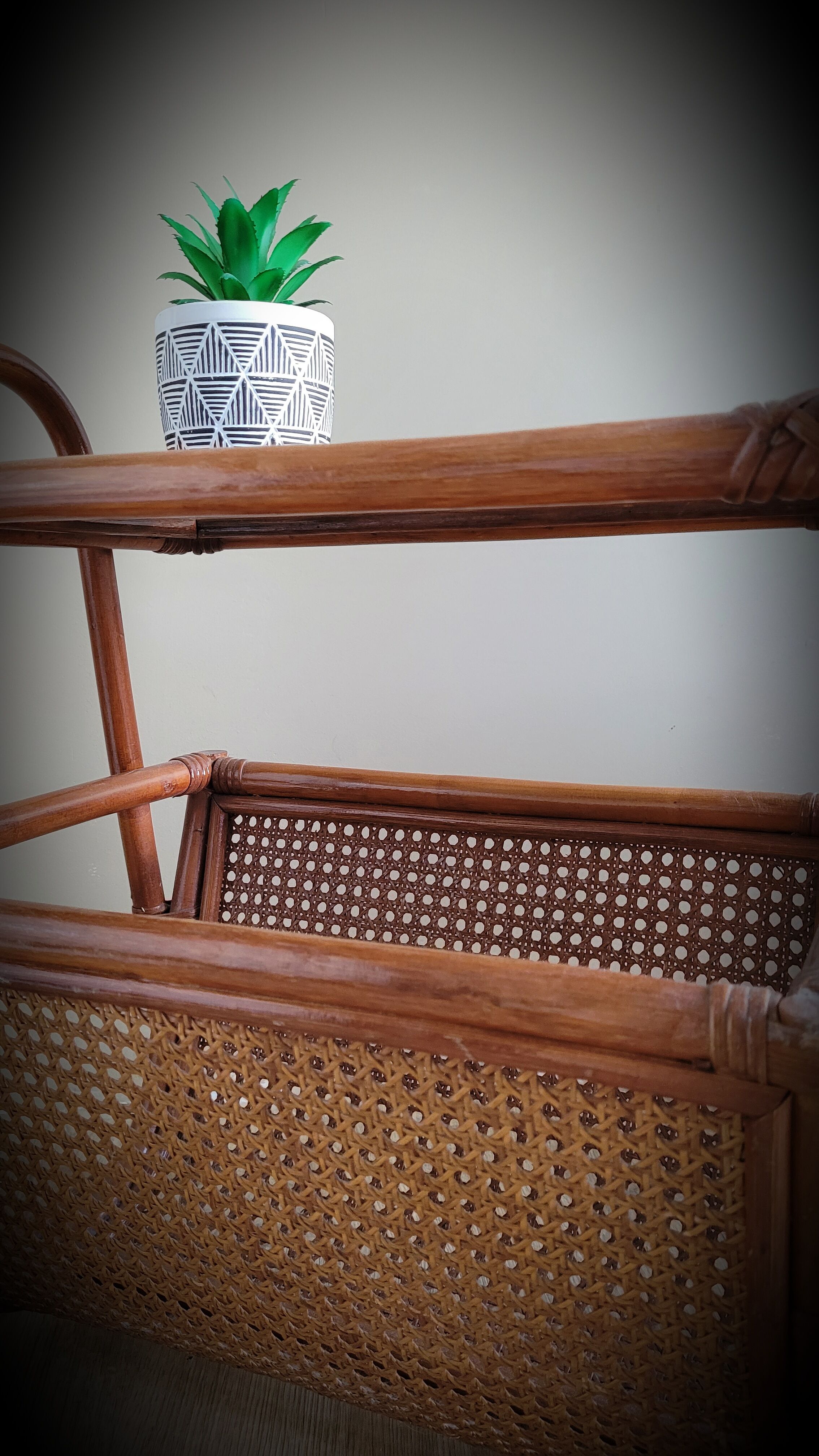 Braided rattan side table and smoked glass