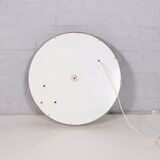 Bright round mirror in plexiglass