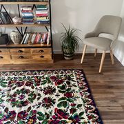 White vintage floral rug made by hand in Romania, beautiful flowers