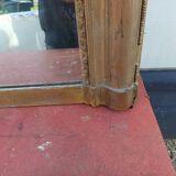 19th century mirror in wood and gilded stucco "scallop shell"