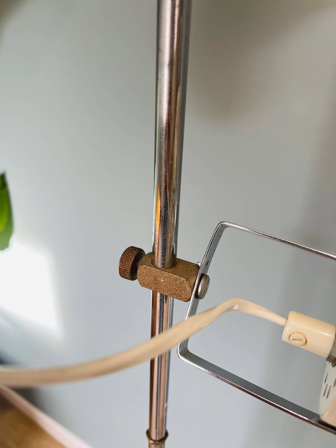 Chrome and white metal floor lamp, circa 1970.