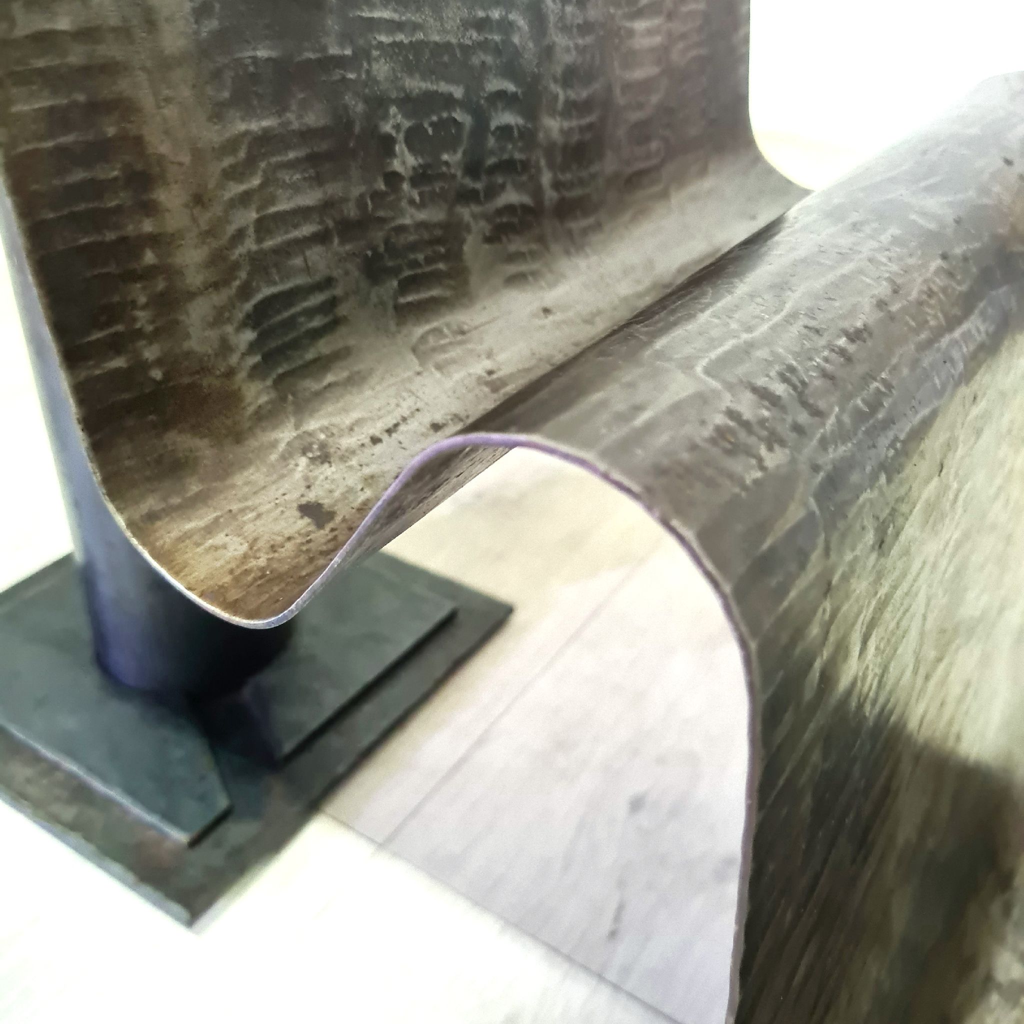 Curved sheet metal side table with magazine stand, 1980s