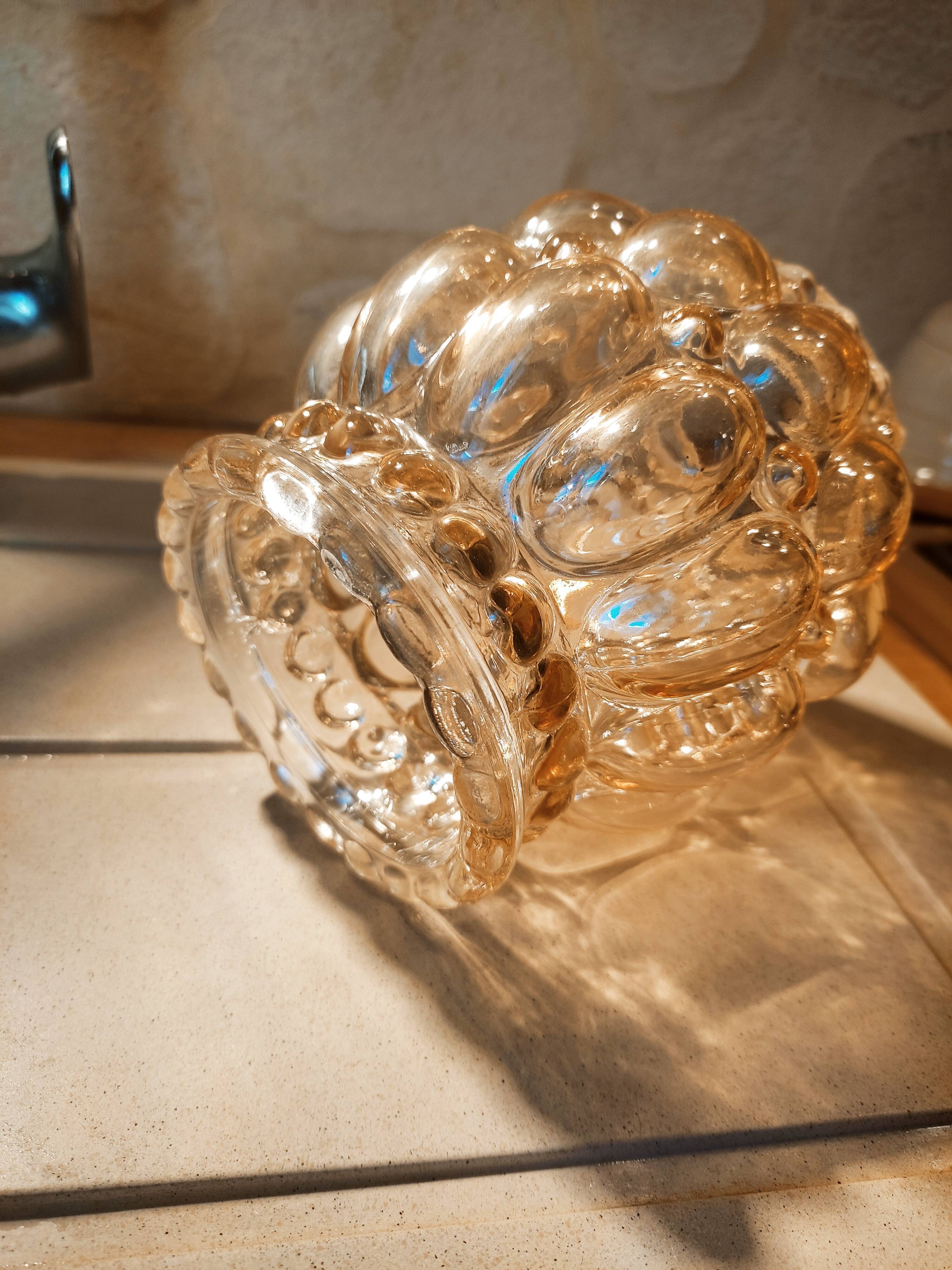 Tulip in iridescent golden glass