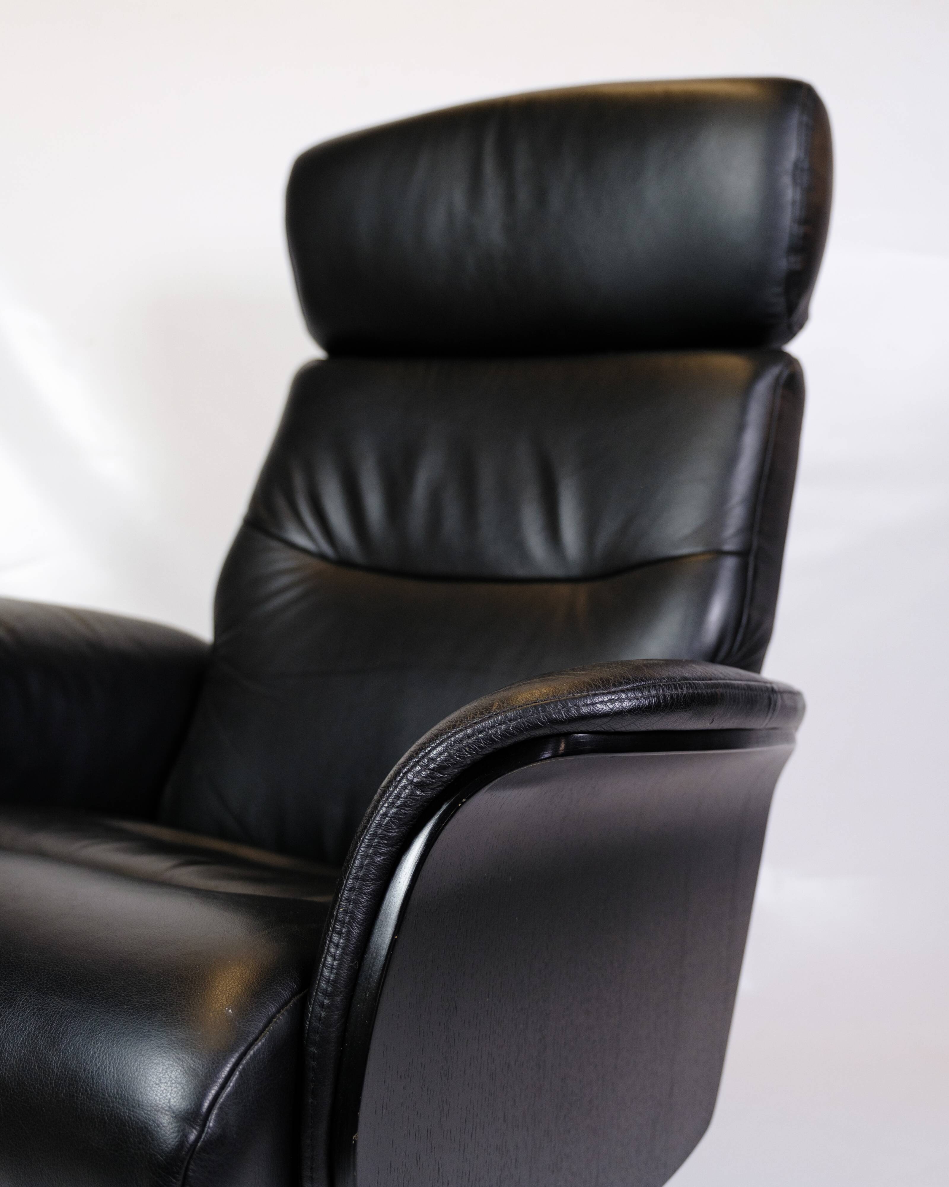 Lounge chair made in black leather & aluminium swivel from 1970s