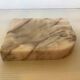 Asymmetrical marble ashtray emptier