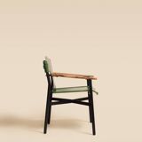 Maërl armchair, Galathée model, green leather, solid wood armrests of your choice