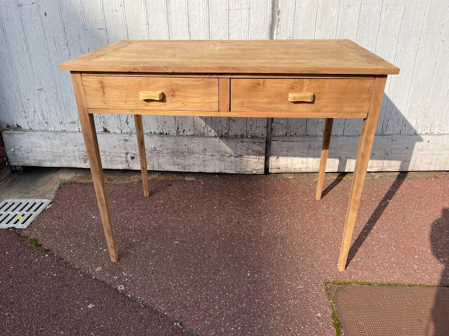 Vintage wooden desk with two drawers.