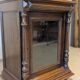 Two-body display cabinet in oak, Henri II style.