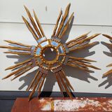 2 wooden sun mirrors and golden plaster