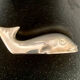 8 whale-shaped knife holders in silver metal