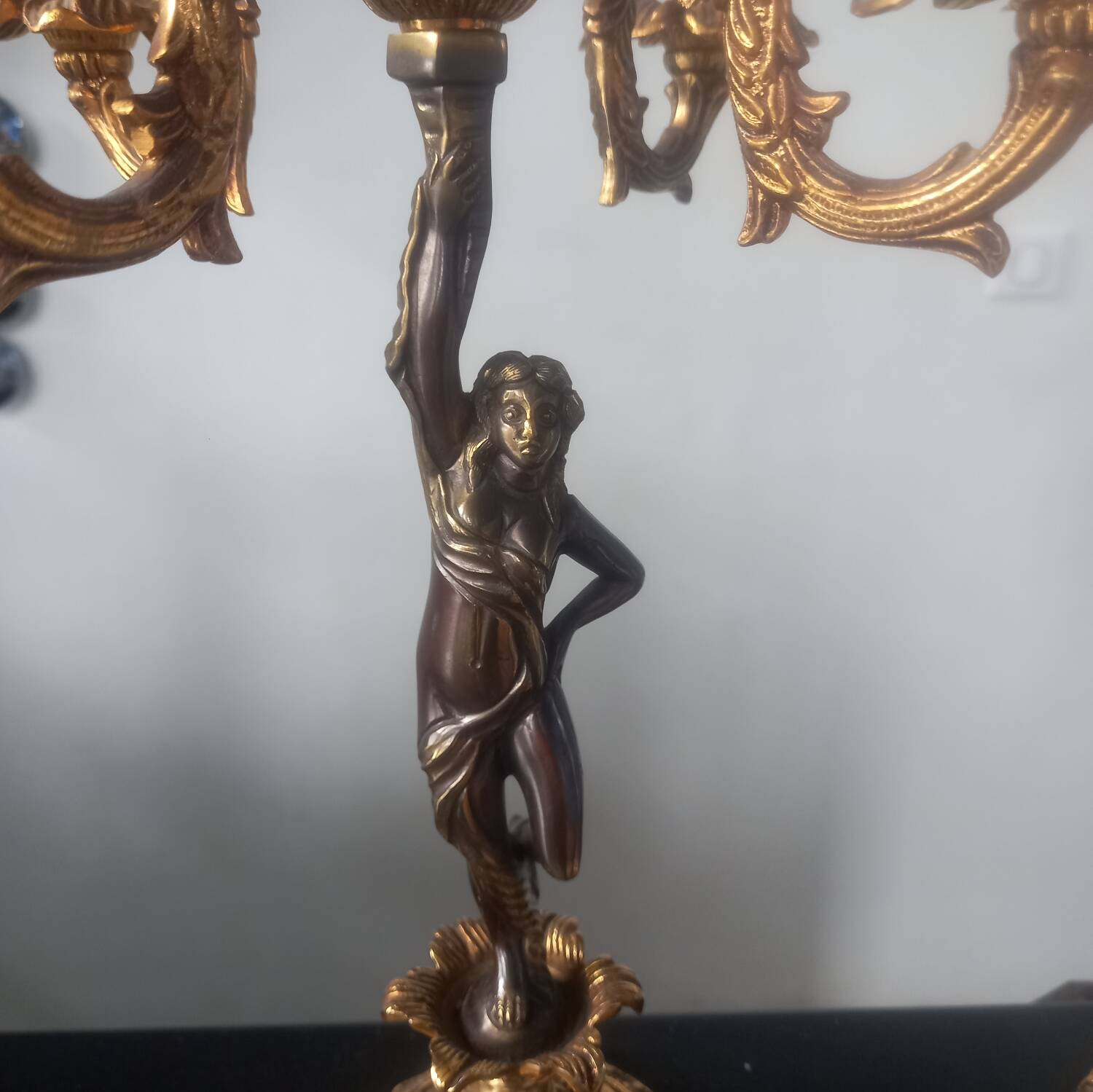Pair of gilded bronze candlesticks with nude women