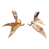 Pair of patina metal candle holders