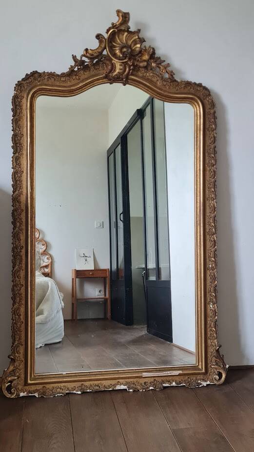Antique Louis Philippe mirror with a pediment.