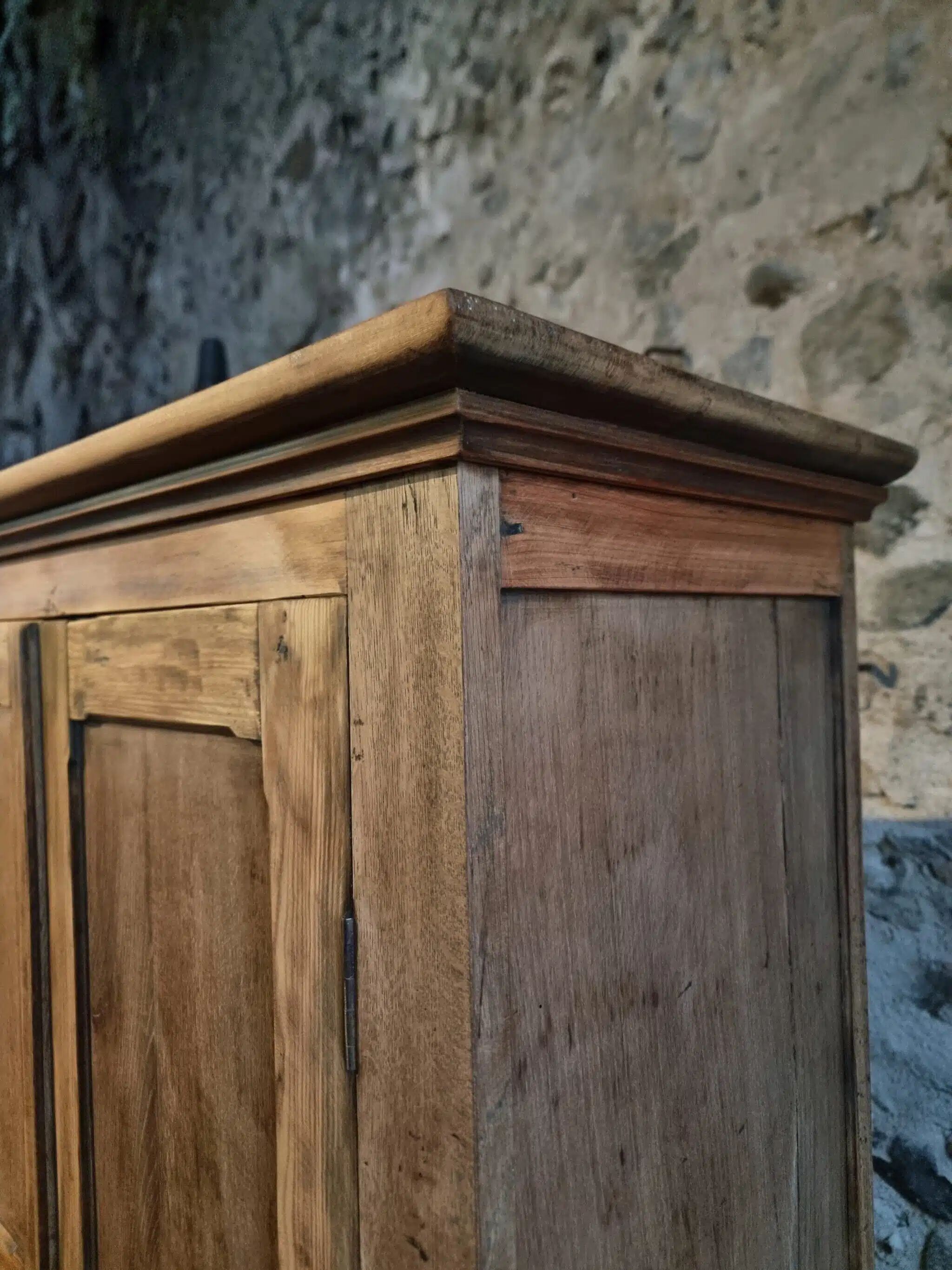 Antique French wardrobe in oak and pine, late 19th century.