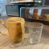 Vichy curist glass graduated in his leather and straw bag