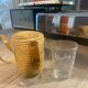Vichy curist glass graduated in his leather and straw bag