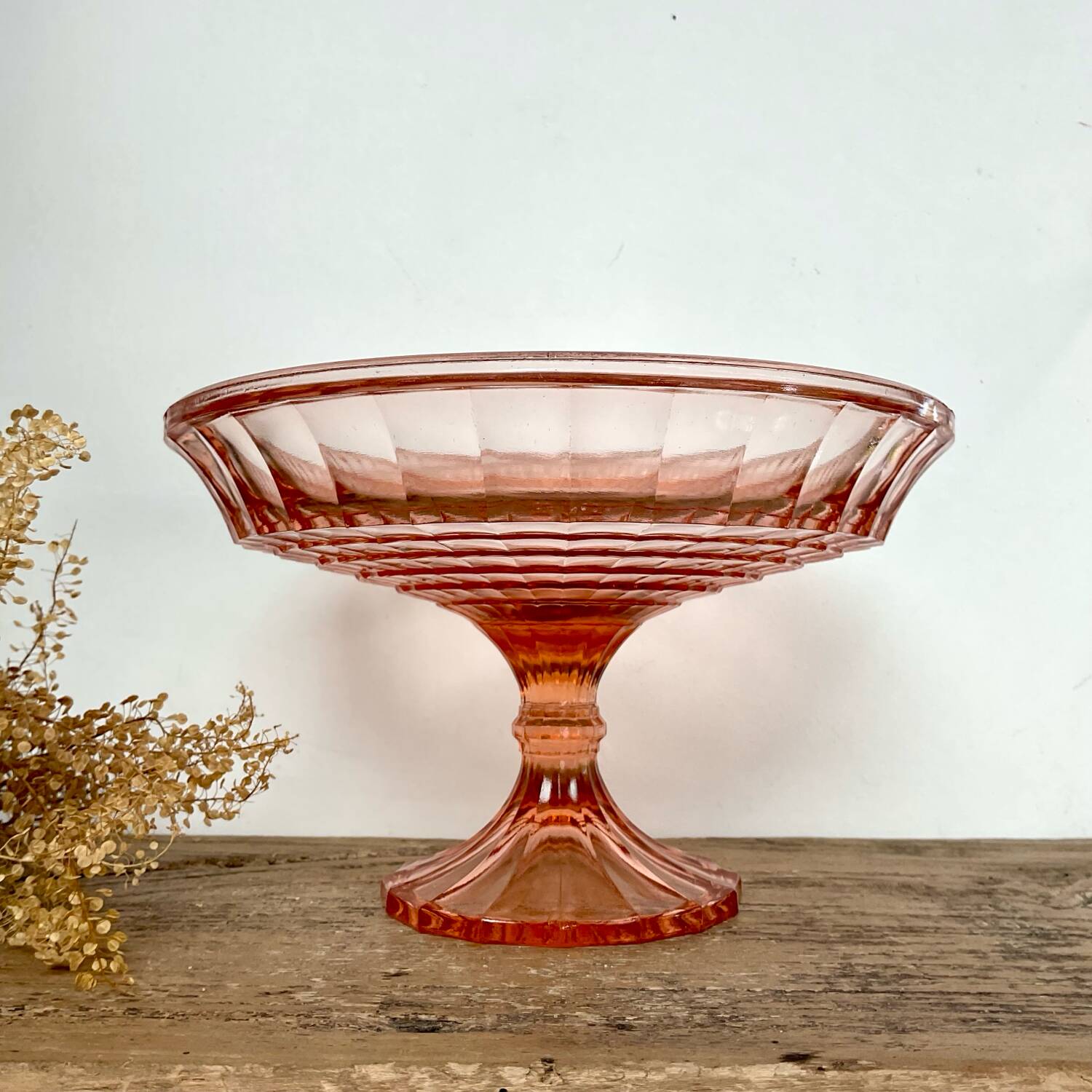 Pink glass cup, fruit bowl