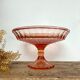 Pink glass cup, fruit bowl