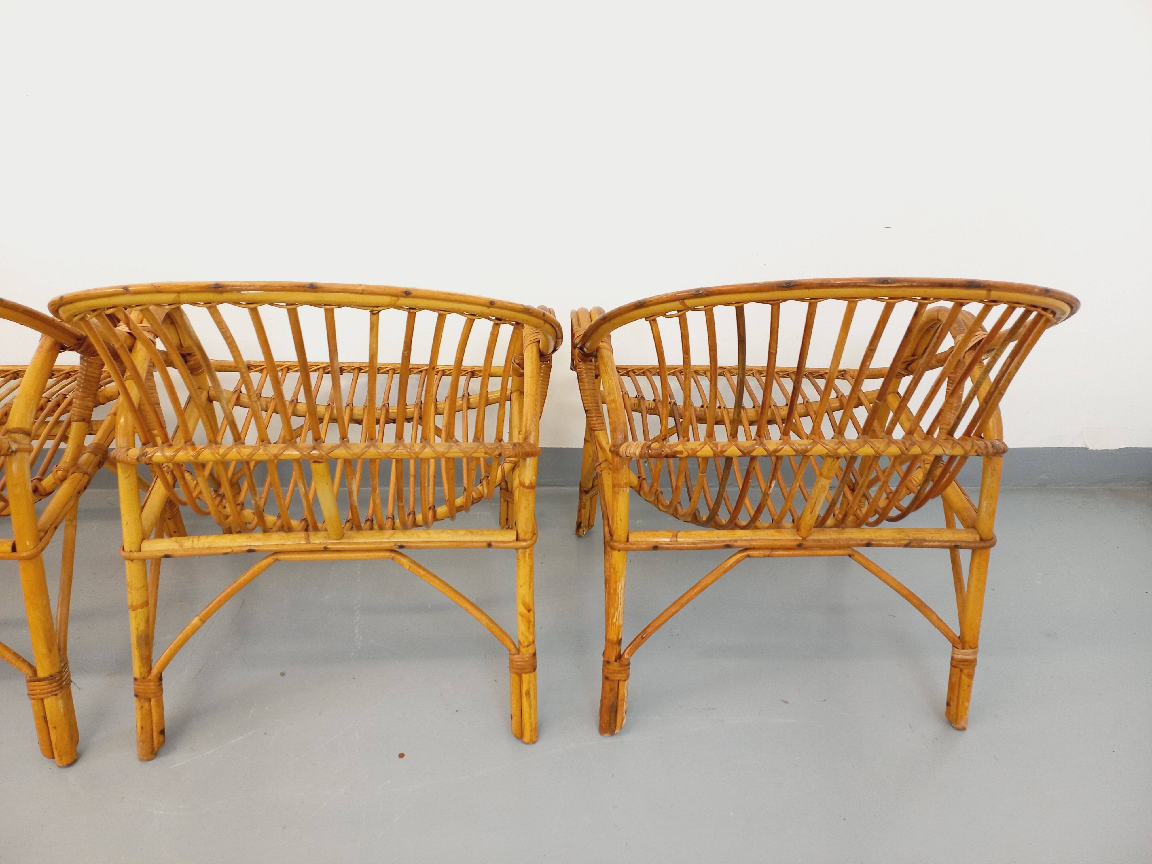 Set of 4 vintage rattan armchairs from the 60s