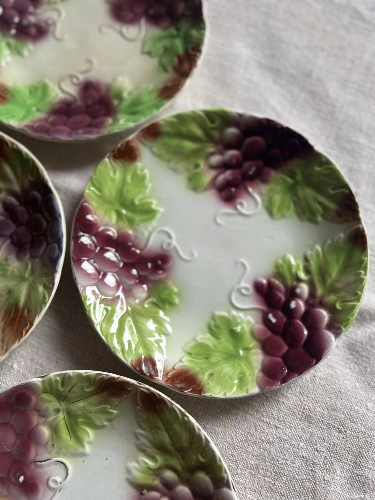 Set of eight flat dessert plates in barbotine earthenware with grape decoration – circa 1900.