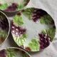Set of eight flat dessert plates in barbotine earthenware with grape decoration – circa 1900.