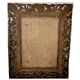 Miroir biseauté et bois sculpté