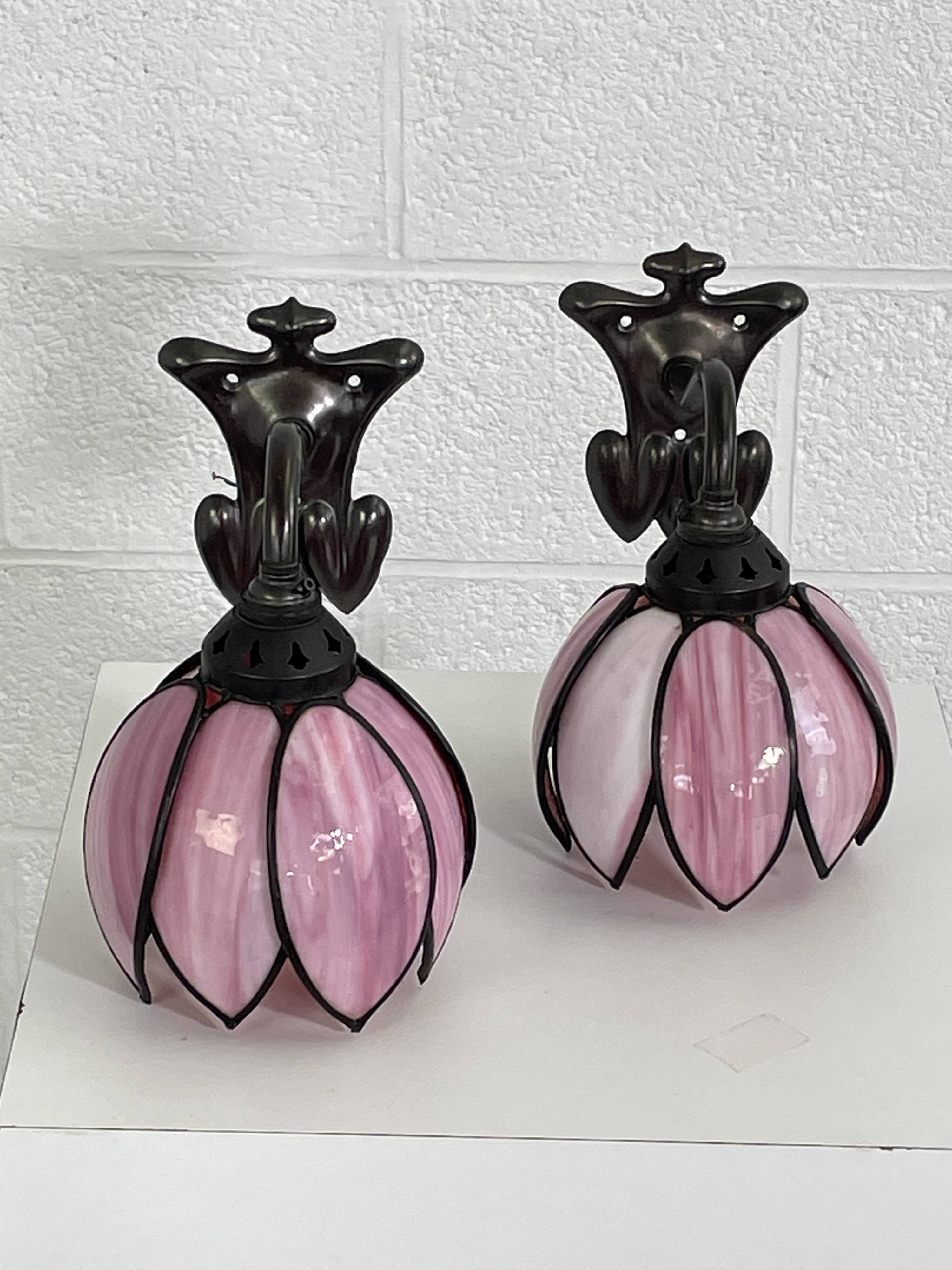 pair of iron wall lights and Tiffany style glass legs