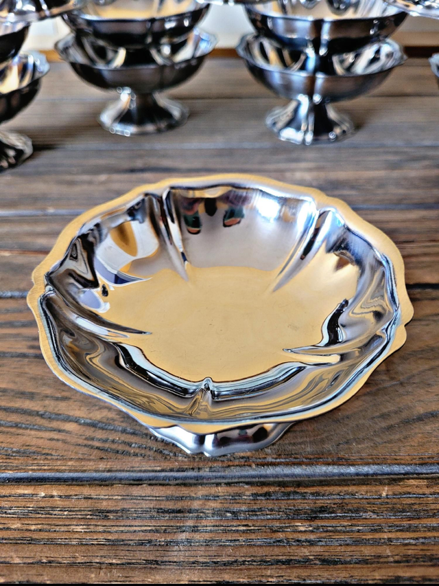 Stainless steel ice bowls by Guy Degrenne, low bowls in the shape of a flower.