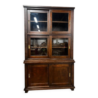 Vintage wooden display cabinet with sliding doors.