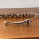 Series of 8 vintage Dachshund knife holders in silver metal