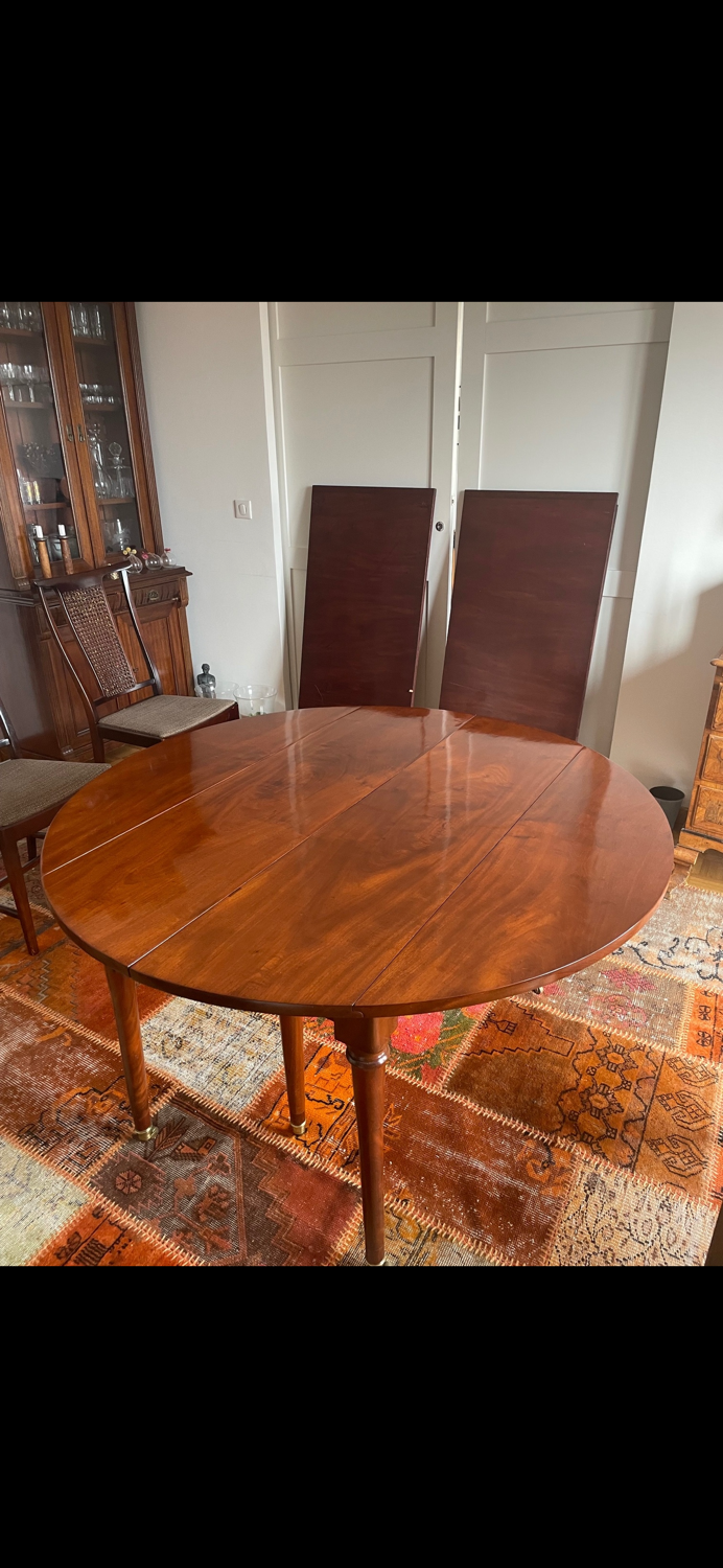 Solid mahogany dining table from the Louis XVI period, extendable.