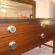 Avalon sideboard in brown teak veneer, chrome handles and wooden legs, 1960s.