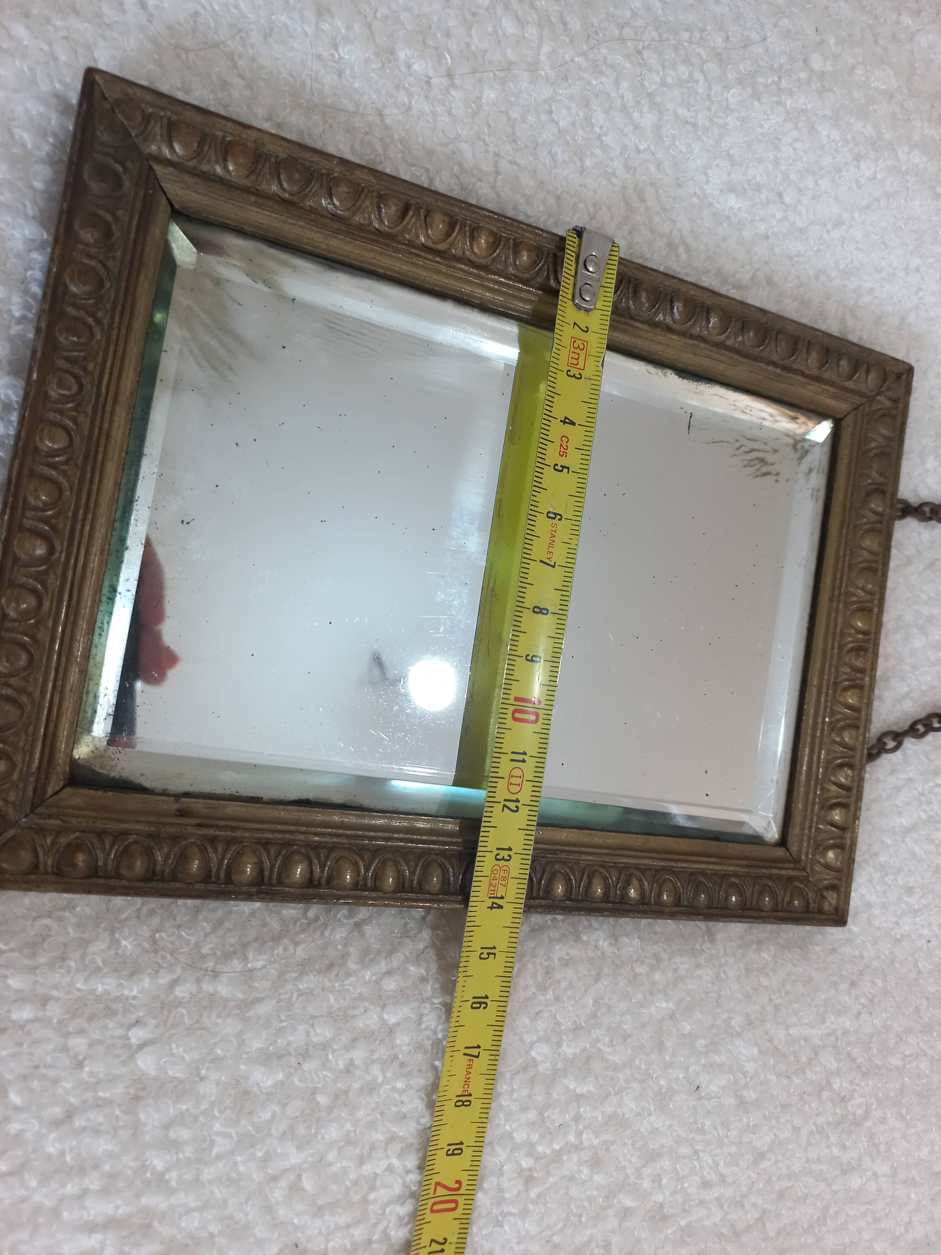 Small vintage mirror in gilded wood, bevelled glass with chain.