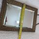 Small vintage mirror in gilded wood, bevelled glass with chain.