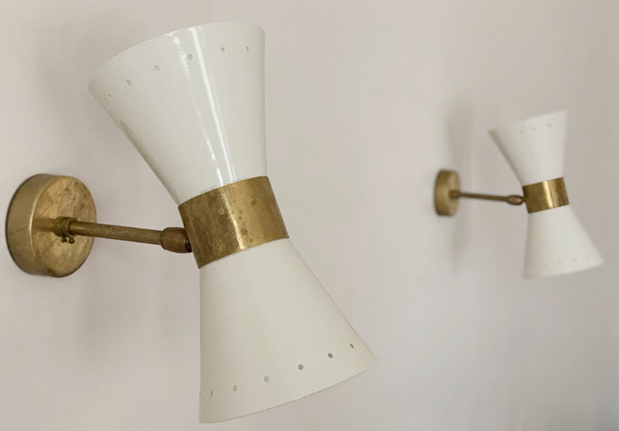Pair of white diabolo wall lights