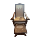 Wooden and straw meridian with foot rest.
