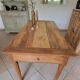 Old farmhouse table made of solid walnut wood.