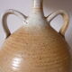 Lamp with sandstone handles