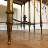 Pull-out tables in golden brass and marble