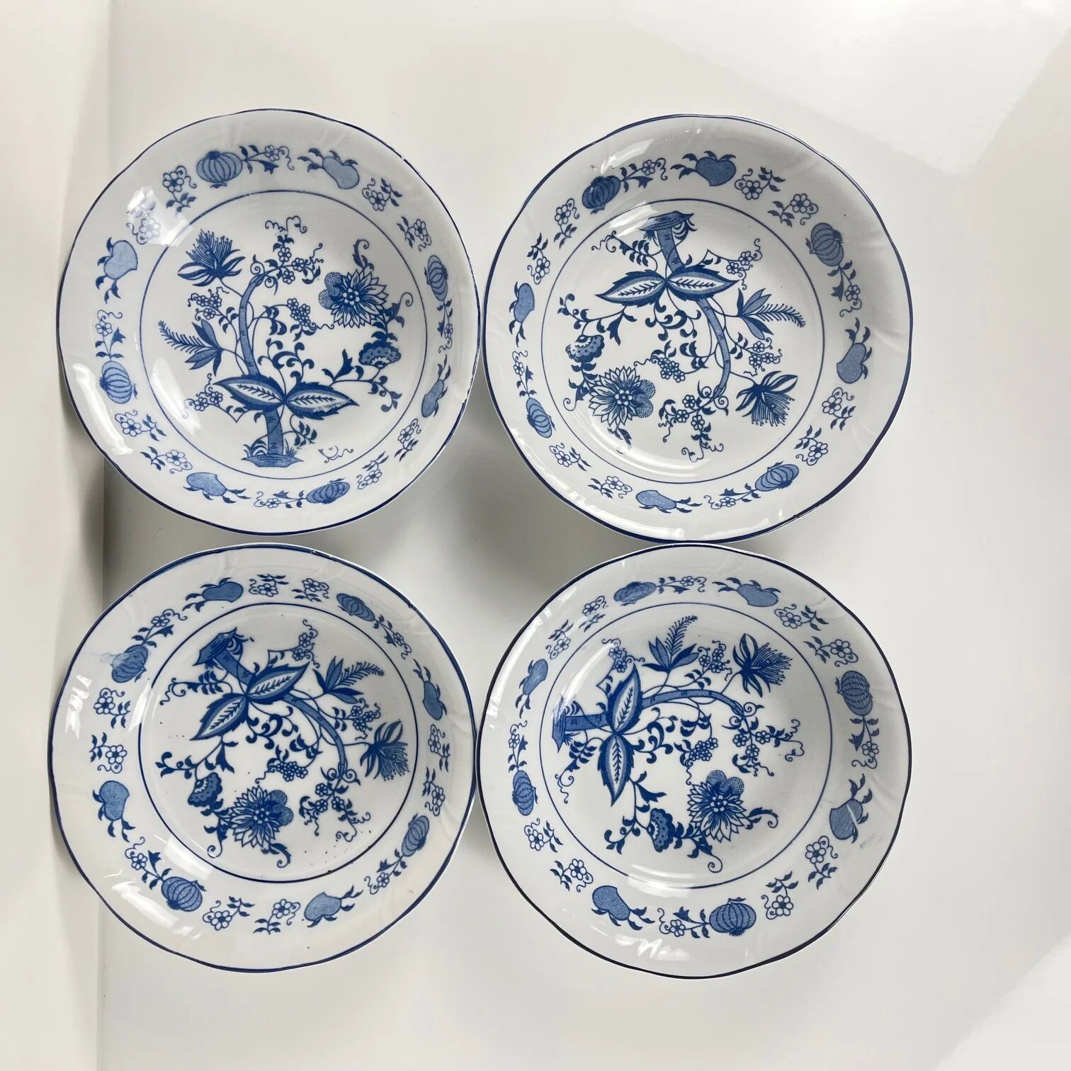 4 bowls / small dishes with blue onion pattern